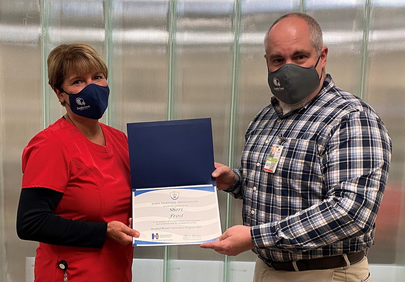 Sheri Frost, Vice Chair of the DCH Board of Trustees, received her IHA Hospital Board Certification. Mike Johnston, DCH CEO, presents the award.