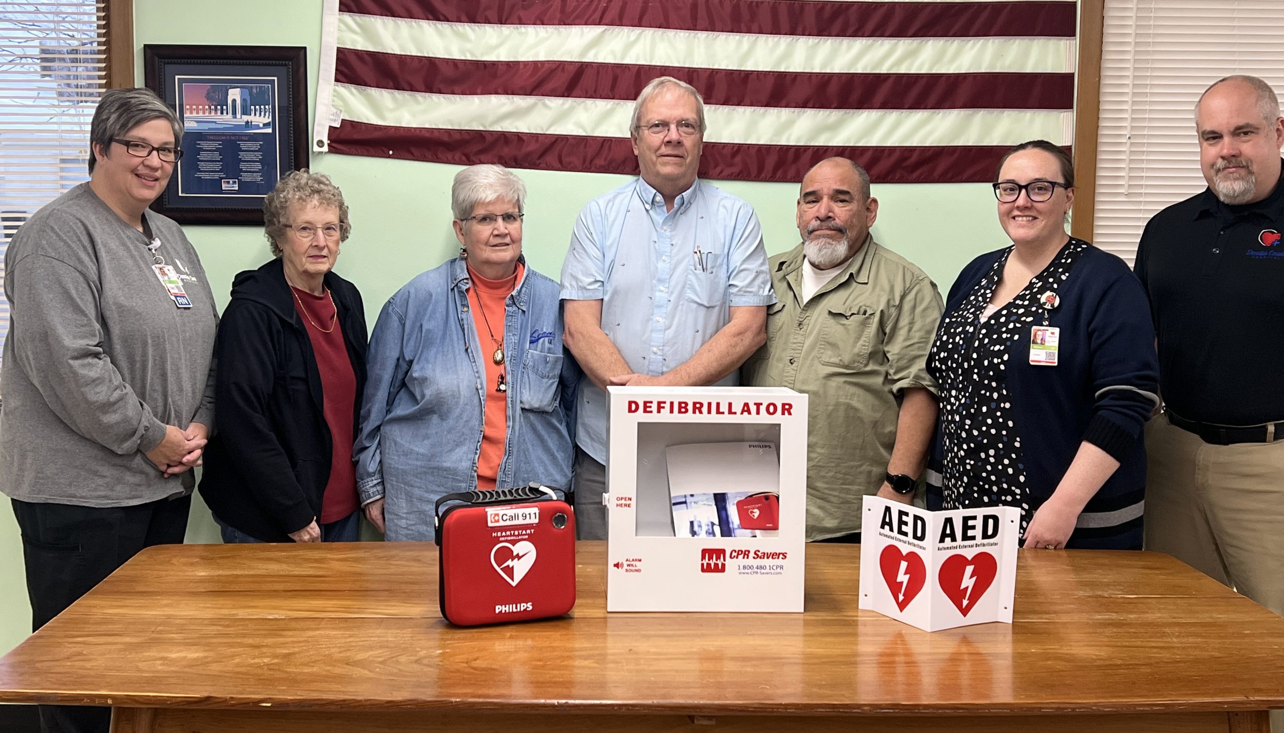 Decatur County Hospital presents a defibrillator (AED) to the Leon Public Library. Pictured l-r: Kelly Barker, DCH CNO; Connie Marker, Library Trustee; Jan Chambers, Library Trustee; John Dunsdon, Library Director; Oscar Ortiz, Library Trustee; Shannon Erb, DCH CHRMO; and Mike Johnston, DCH CEO.